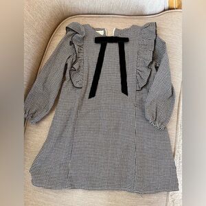 Black and white long sleeve dress with black velvet bow.